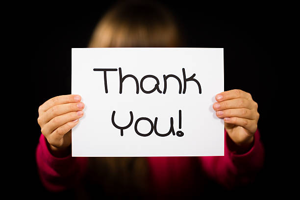 istock Child holding Thank You sign 518652798