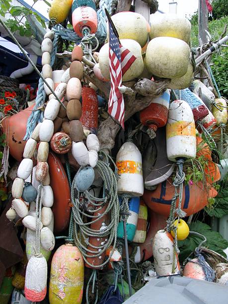 istock Colorful hanging old buoys background 518653730