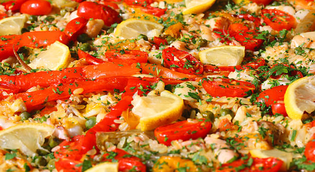 istock paella valenciana with seafood and vegetables 518655143