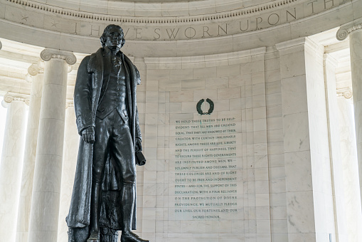 Statue of Thomas Jefferson with inscription from the Declaration of Independence inside the Jefferson Memorial in Washington DC