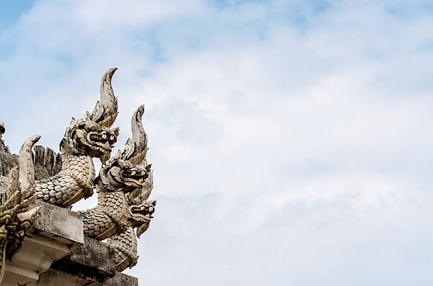 istock Naga statue in thai temple on blue sky background 518655521
