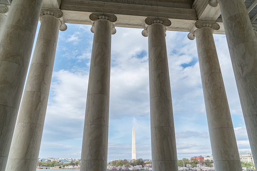 View of the Washington Monument through the columns of the Jefferson Memorial in Washington DC