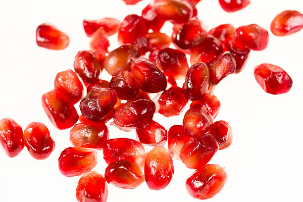 istock Pomegranate seeds on a white background 518656251
