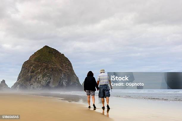 Xxxl Mature Couple Walking On The Beach Stock Photo - Download Image Now - Mature Women, Shorts, Walking