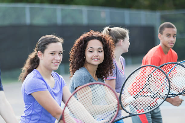 istock Teenagers playing tennis 518656983