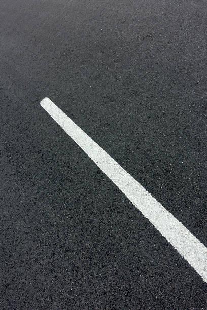 istock background texture of rough asphalt road 518657345