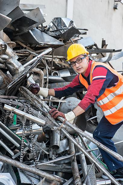 istock Worker in Metal Landfill 518657439