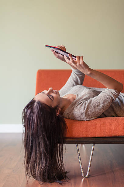 istock Young Woman Reading A Digital Tablet 518657765