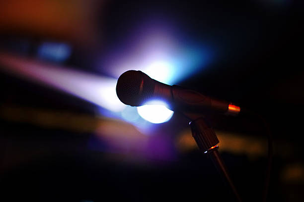 istock Close-up of microphone on stage 518657812