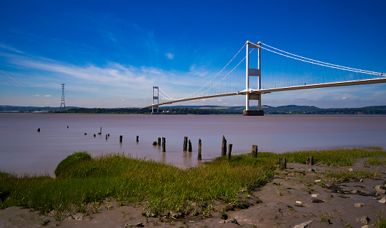 The crossing of the river Severn seen from the muddy and rocky shoreline