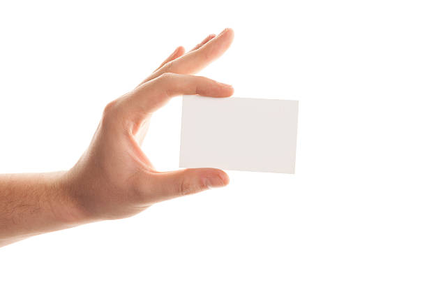 istock Holding business card isolated on white 518658858