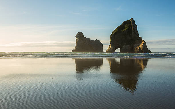 istock Rocky Islands at Wharariki Beach 518659170