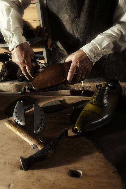 istock craftsman making luxury handmade man shoes 518660320