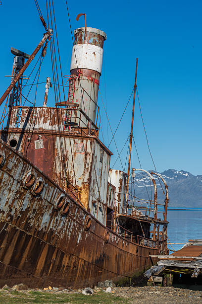 istock Close-up of rusty whaler moored by jetty 518661708
