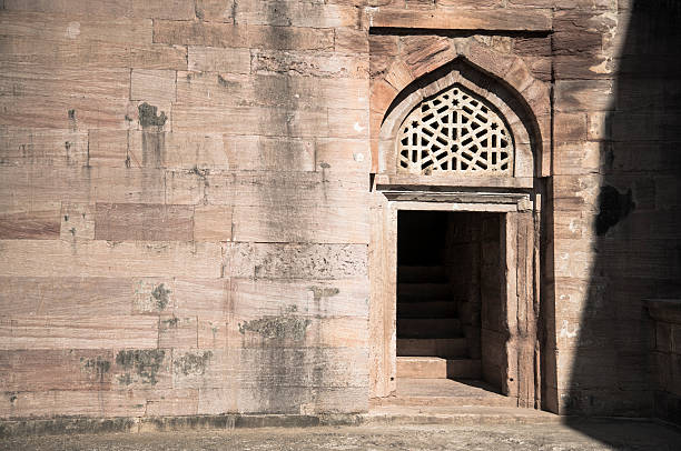 istock Shadowy Doorway with an Ornate Overhead Stone Carvings 518663102