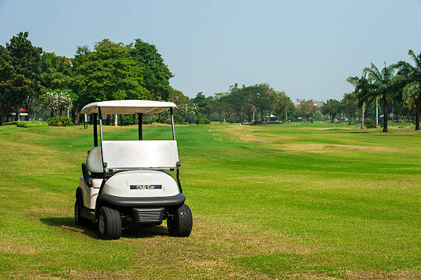 Golf course lanscape and a cart over white background with space for your text. Spring field