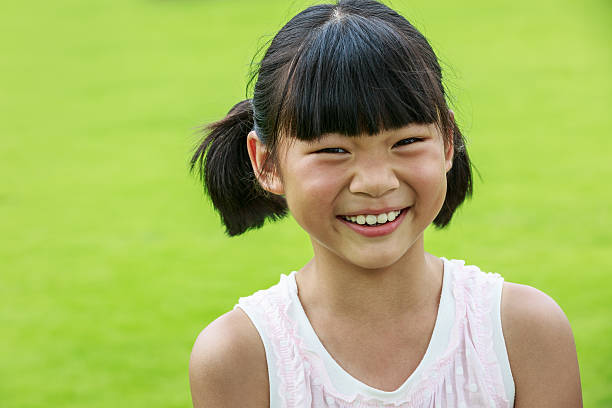 istock happy Oriental little girl lovely expression 518677828