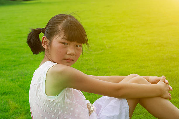 istock happy Oriental little girl lovely expression 518677982
