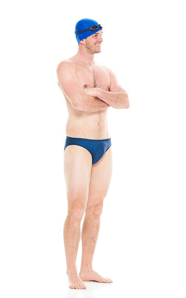 istock Smiling swimmer standing with arms crossed 518679134