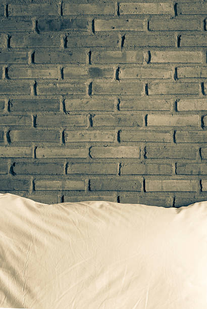 istock Vintage tone style brick wall with white pillow 518679282