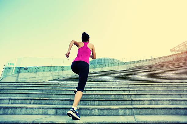 istock Runner athlete running on stairs. 518679597