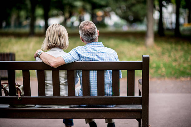 istock Couple sitting on a bench 518680881