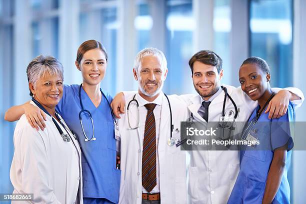 Staying Positive As A Team Stock Photo - Download Image Now - Arm Around, Doctor, Hospital