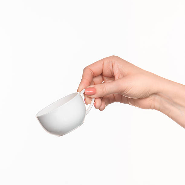 istock Woman hand with cup on white background 518683588