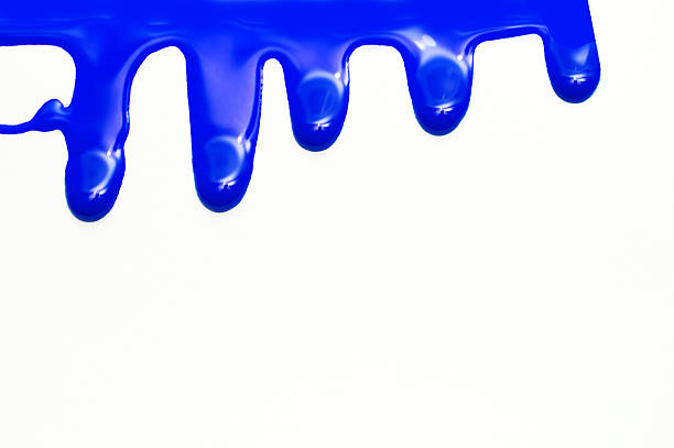 istock close up of blue paint leaking on white background 518684918