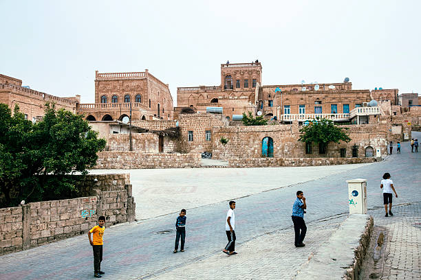 Midyat Streets Mardin, Turkey - May 12, 2012: Children playing in the streets of Midyat. Historical Stone House in Midyat-Mardin, Turkey. The was used as Guest House in the past Nowadays it is open for visitation. One of the most populer tv series in Turkey has been shot there. Therefore it is very populer for tourists.  midyat photos stock pictures, royalty-free photos & images