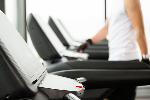 istock young handsome asian man works out in modern gym 518687776