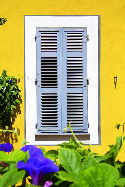 istock Beautiful window on color wall 518697877