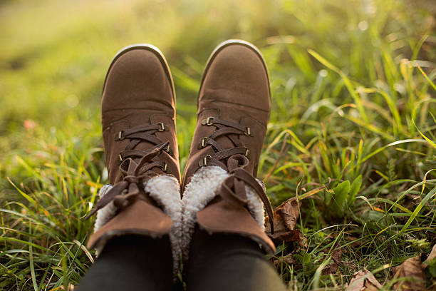istock female feet in boots 518698265