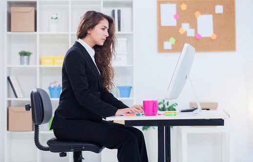 Businesswoman working at her desk