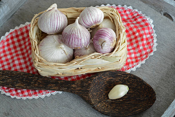 istock Country style decorated garlic on grey wood 518698717