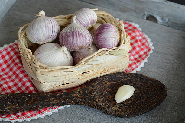 istock Country style decorated garlic on grey wood 518698725