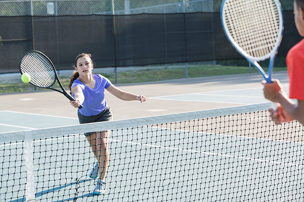 istock Teenagers playing tennis 518698849
