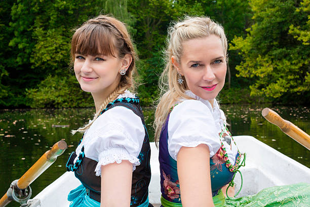 istock two woman in a rowing boat 518699743