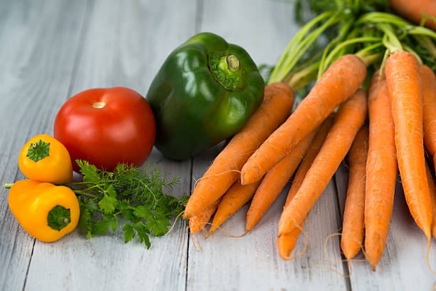 istock Mixed vegetables on a grey wooden background 518700028