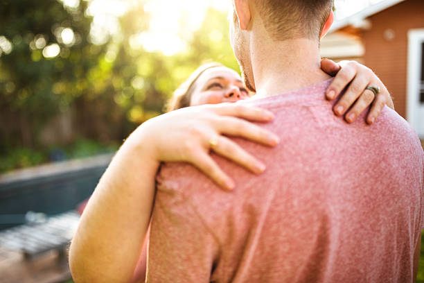 istock lovely couple flirting at sunset 518700080