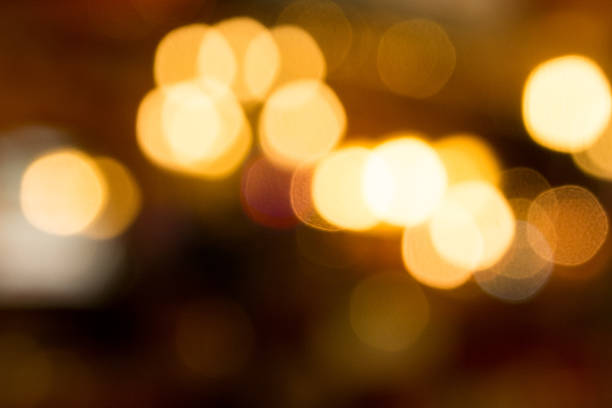 istock Yellow bokeh light at night background 518700095