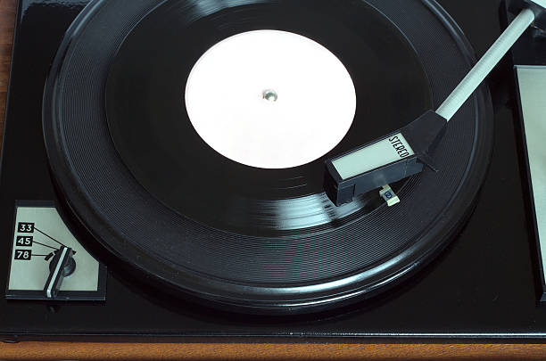 istock Vintage turntable with vinyl record top view closeup 518701960