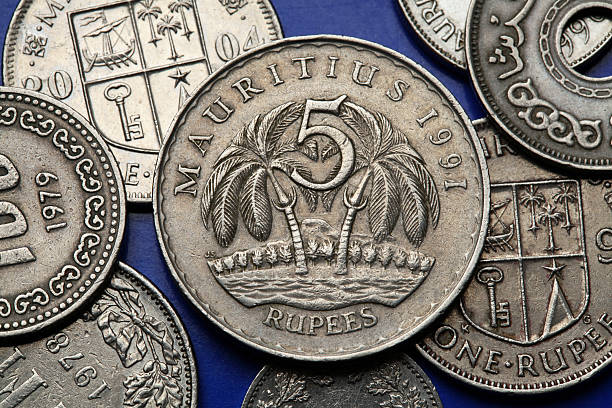 Coins of Mauritius Coins of Mauritius. Two palm trees depicted in the Mauritian five rupee coin. 1991 stock pictures, royalty-free photos & images