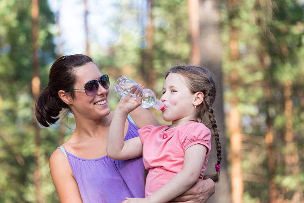 istock Little girl drinks water 518702939