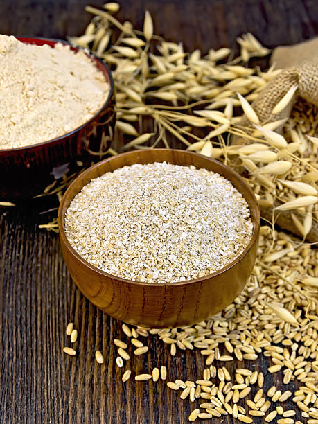 istock Bran flakes in bowl with grain on board 518703602