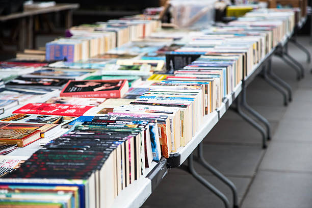 second hand books for sale in open air market stock photo