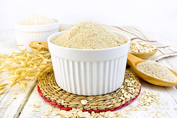istock Flour oat in white bowl on board 518703760
