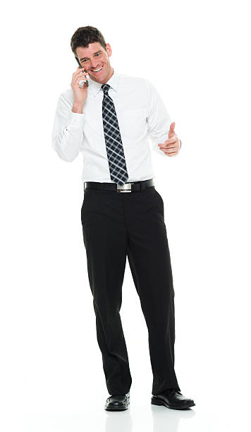 istock Smiling businessman talking on phone 518704596