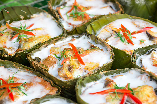 Colorful and tasty steamed seafood in curry coconut paste