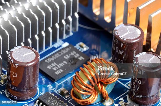 Closeup Of Inductors Capacitors Cooler And Chips Stock Photo - Download Image Now
